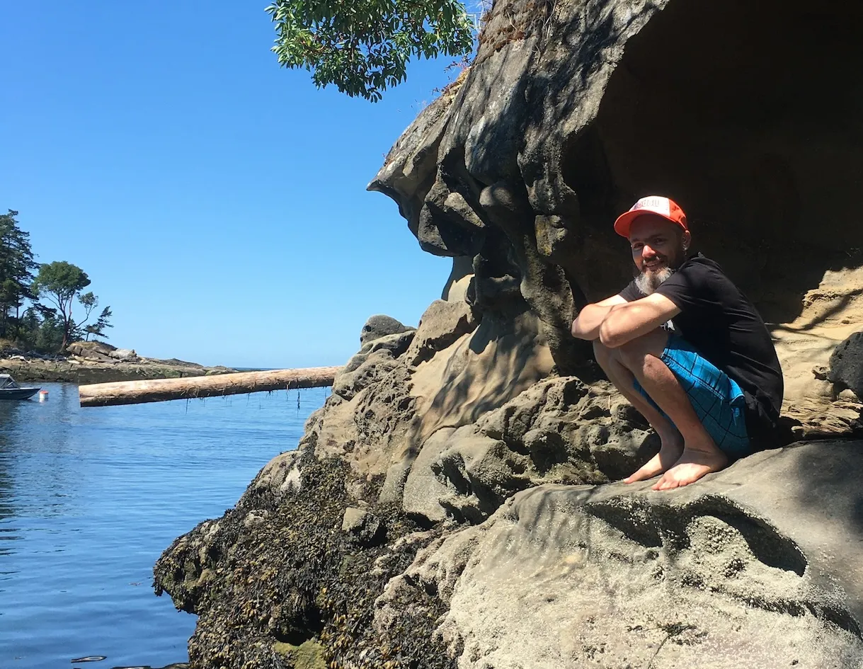 me sitting on some rocks next to the Ocean in David&#x27;s Cove